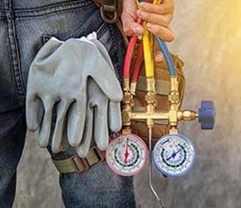 ac-repair-services-carrying-gauges-and-gloves