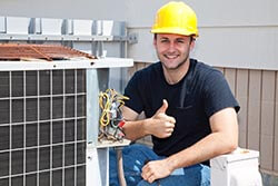 air-conditioner-repairman-performing-maintenance-tuneup